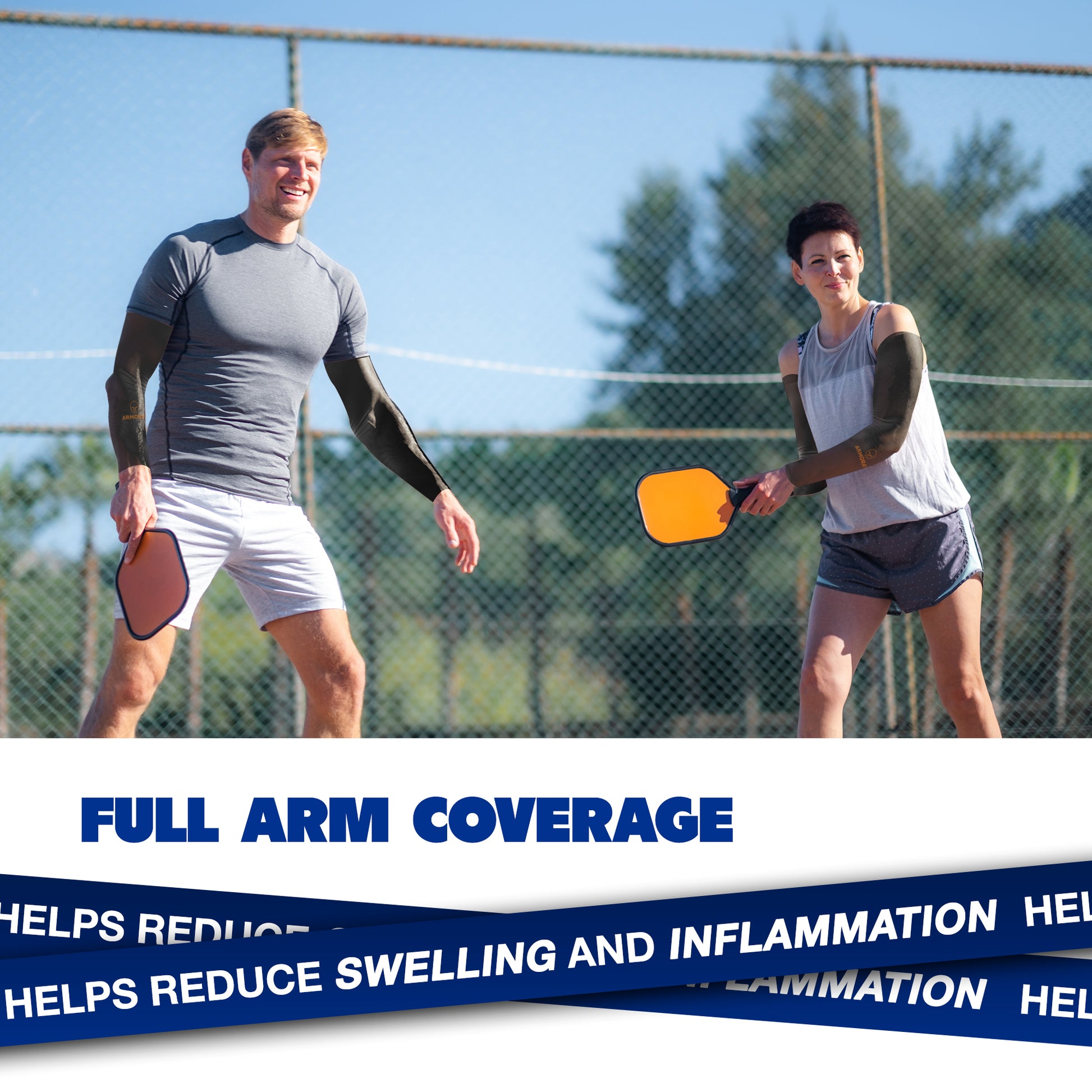 A man and woman play outdoor pickleball wearing ARMORAY Basics Armoray® Arm Sleeves, enjoying cooling comfort, sun protection, and help reducing swelling and inflammation.
