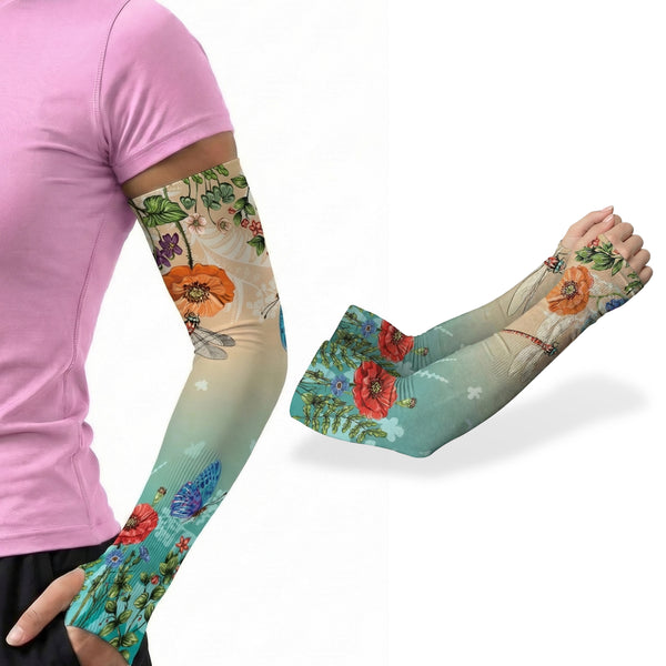 A person in a light purple shirt showcases an ARMORAY Basics Armoray® Garden Collection Arm Sleeve—colorful floral and butterfly print, UPF 50+—with another sleeve from the set displayed beside them.