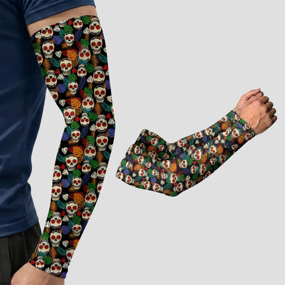 Wearing an ARMORAY® Armoray® Patterned Arm Sleeve—one of 35+ bold designs featuring a colorful skull and floral pattern and providing UPF 50+ sun protection—a person displays the stretchy designer sleeve on their arm, with a second identical ARMORAY sleeve shown alongside on a plain background.