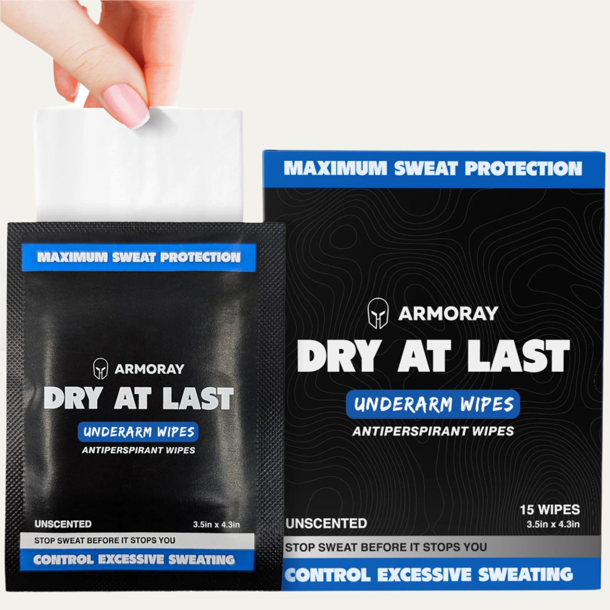 A hand pulls a long-lasting wipe from a single-use packet beside a box labeled "ARMORAY Basics Armoray® Dry At Last Antiperspirant Wipes" for sweat protection and relief from excessive sweating.