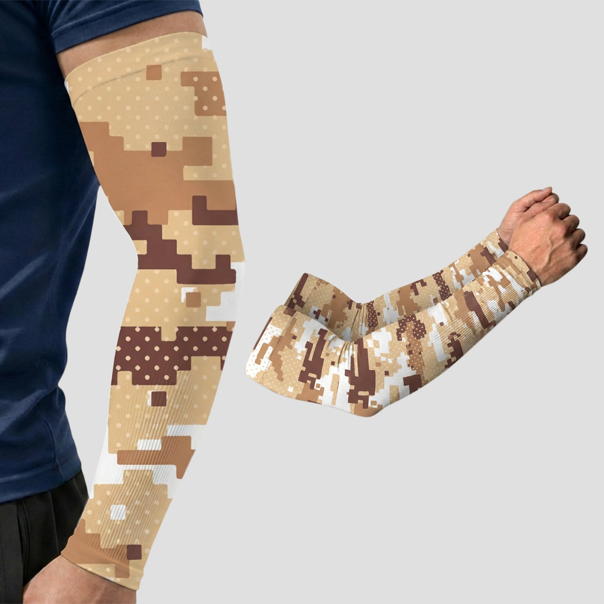 A person models an ARMORAY Armoray® Patterned Arm Sleeve in tan and brown digital camouflage, featuring UPF 50+ sun protection, with a second identical sleeve displayed separately on a grey background.