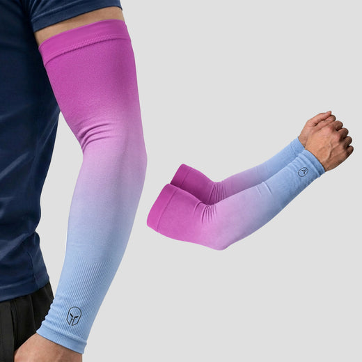 Two arms display ARMORAY Gradient Arm Sleeves in pink and blue compression gradients—one extended, the other crossed—with a no-slip band securing each sleeve and the ARMORAY logo visible near the wrist, delivering UPF 50+ UV protection.