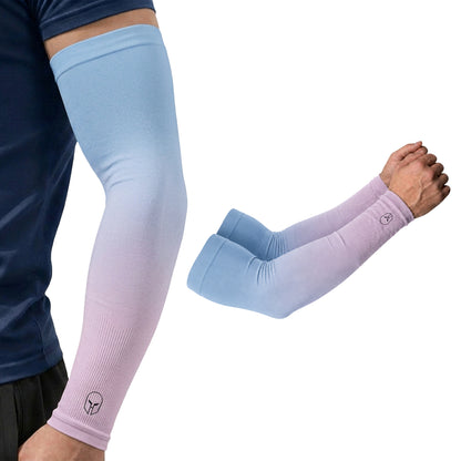 Close-up of a person wearing an ARMORAY Ombré Collection arm sleeve featuring a gradient blue-to-purple design, with another pair of UPF 50+ sleeves from the collection displayed nearby for extra UV protection.