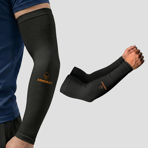 A person wears an ARMORAY® Classic Arm Sleeve in black, featuring the distinct “ARMORAY” logo. Shown both worn and displayed separately on a plain background, this sleeve is designed to keep your arm cool, comfortable, and protected during any activity.