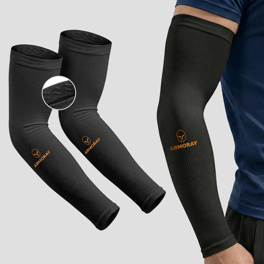 A person is wearing a black Armoray® Silicone Grip SecureFit™ Arm Sleeve from ARMORAY, designed for sun protection; two more identical sleeves are displayed nearby, showcasing the textured fabric, silicone grip feature, and the ARMORAY logo.
