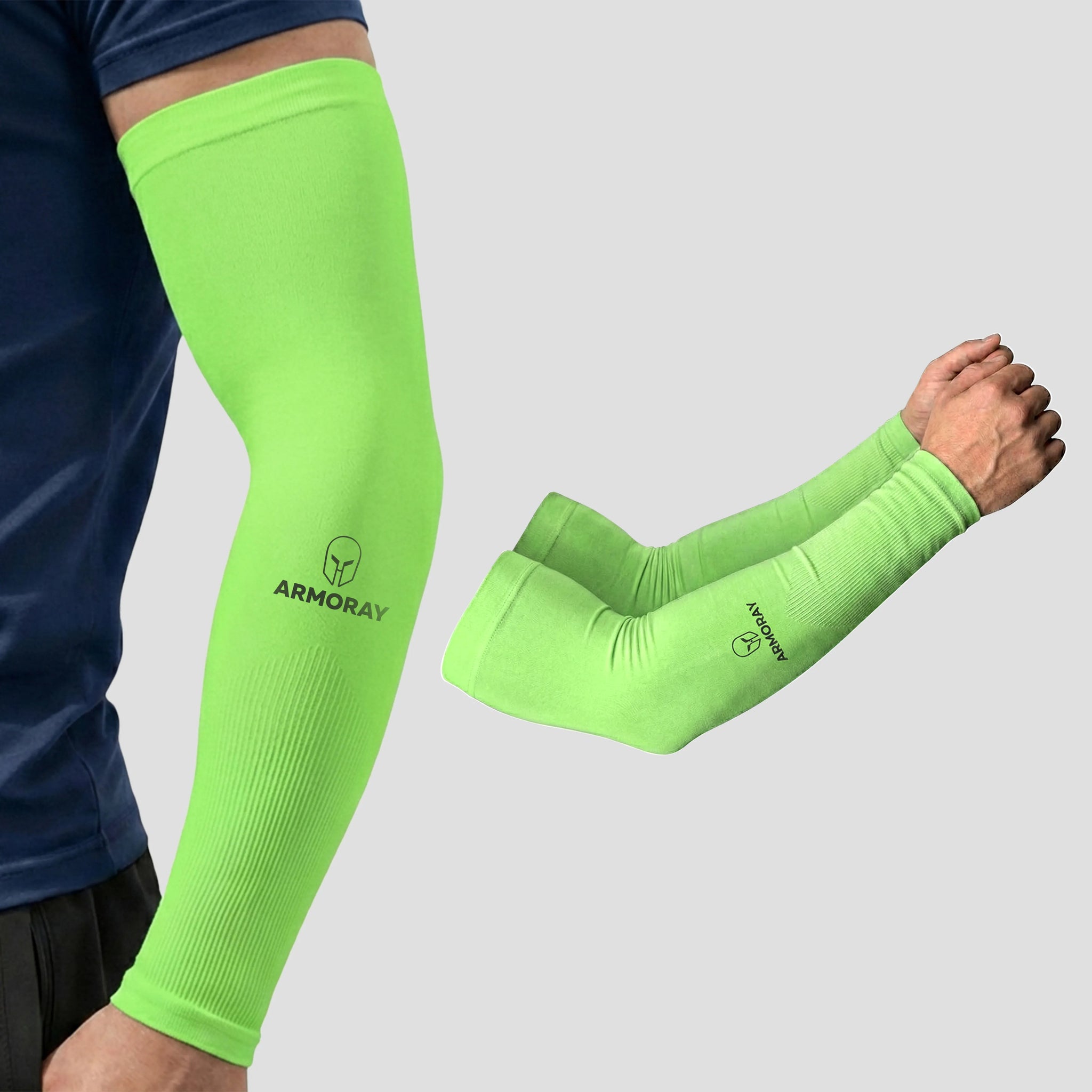 A person wearing Armoray® Classic Arm Sleeves in neon green stays cool, comfortable, and protected; another pair of sleeves lies displayed nearby. Both sleeves showcase the ARMORAY logo on the forearm.