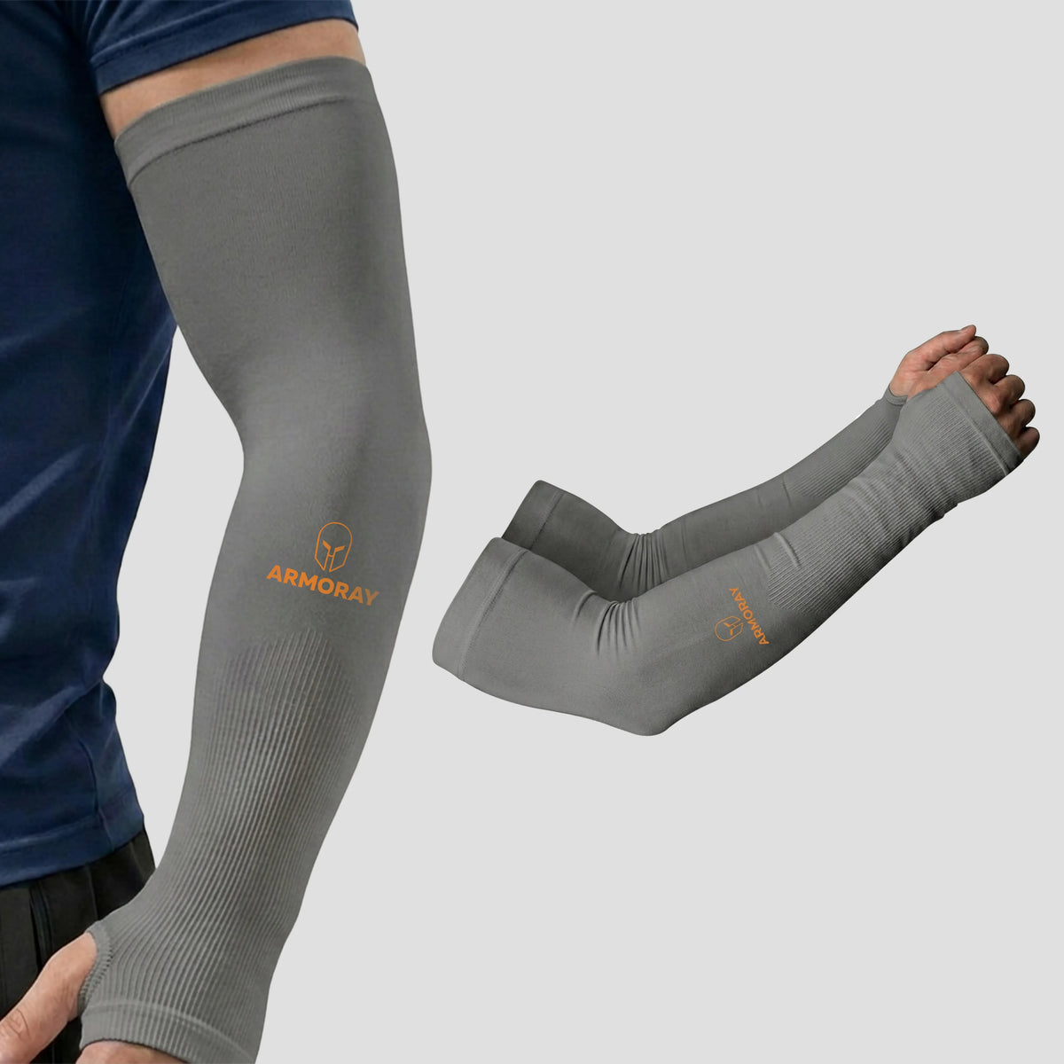 A person wearing Armoray® Thumbhole Arm Sleeves by ARMORAY—gray compression sleeves featuring the orange “ARMORAY” logo, providing sun protection and extended hand coverage with thumbholes—is shown next to a pair of sleeves displayed on a neutral background.
