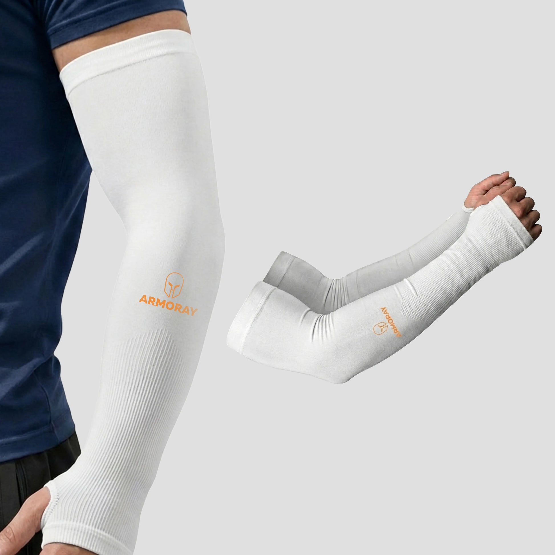 A person wears Armoray® Thumbhole Arm Sleeves by ARMORAY, featuring a white compression design with extended hand coverage and convenient thumbholes for added comfort. An extra pair of these sun protection sleeves is displayed beside the wearer on a plain background.