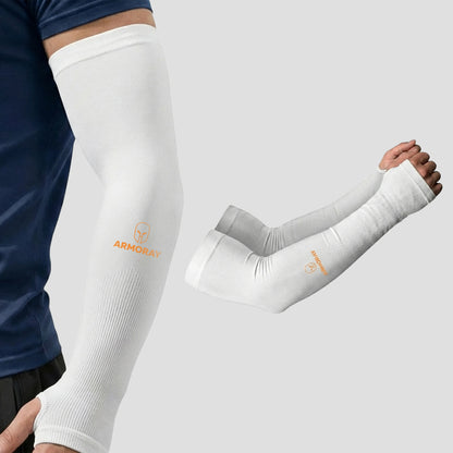 A person wears Armoray® Thumbhole Arm Sleeves by ARMORAY, featuring a white compression design with extended hand coverage and convenient thumbholes for added comfort. An extra pair of these sun protection sleeves is displayed beside the wearer on a plain background.
