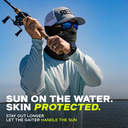 Wearing sunglasses, a hat, and an ARMORAY Basics PERFORMANCE TEK BANDANA, someone fishes on the water under a blue sky. Protect your skin from the sun with this versatile bandana or gaiter.