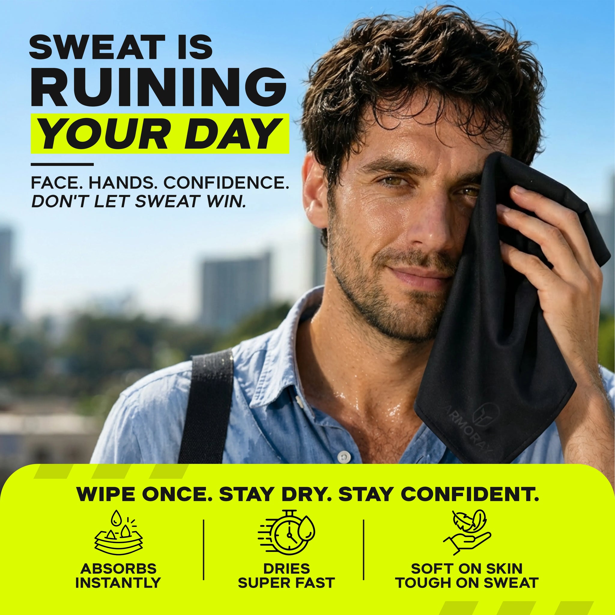 A man wipes sweat from his face outdoors with the ARMORAY Sweat Absorbing Handkerchief – UltraSoft, Reusable Sweat Towel. Instantly absorbs moisture, dries quickly, and feels exceptionally soft on skin—making it ideal for gym workouts. Buildings and a blue sky are visible in the background.