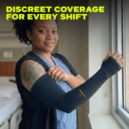 A smiling nurse in scrubs wears Armoray® Thumbhole Arm Sleeves — Designed for Total Protection by ARMORAY, showcasing discreet coverage and extended hand protection in a hospital setting. Bold yellow text reads: “DISCREET COVERAGE FOR EVERY SHIFT.”.