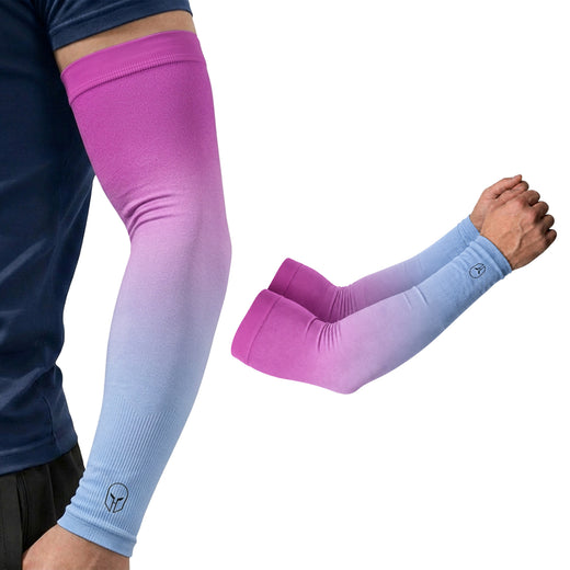 A person wears ARMORAY Gradient Arm Sleeves in pink and blue, showcasing these stylish UPF 50+ sleeves that provide excellent UV protection. The close-up highlights two gradient ARMORAY sleeves—one displaying a visible logo near the wrist—making them perfect for anyone seeking both fashion and functionality with no-slip performance.