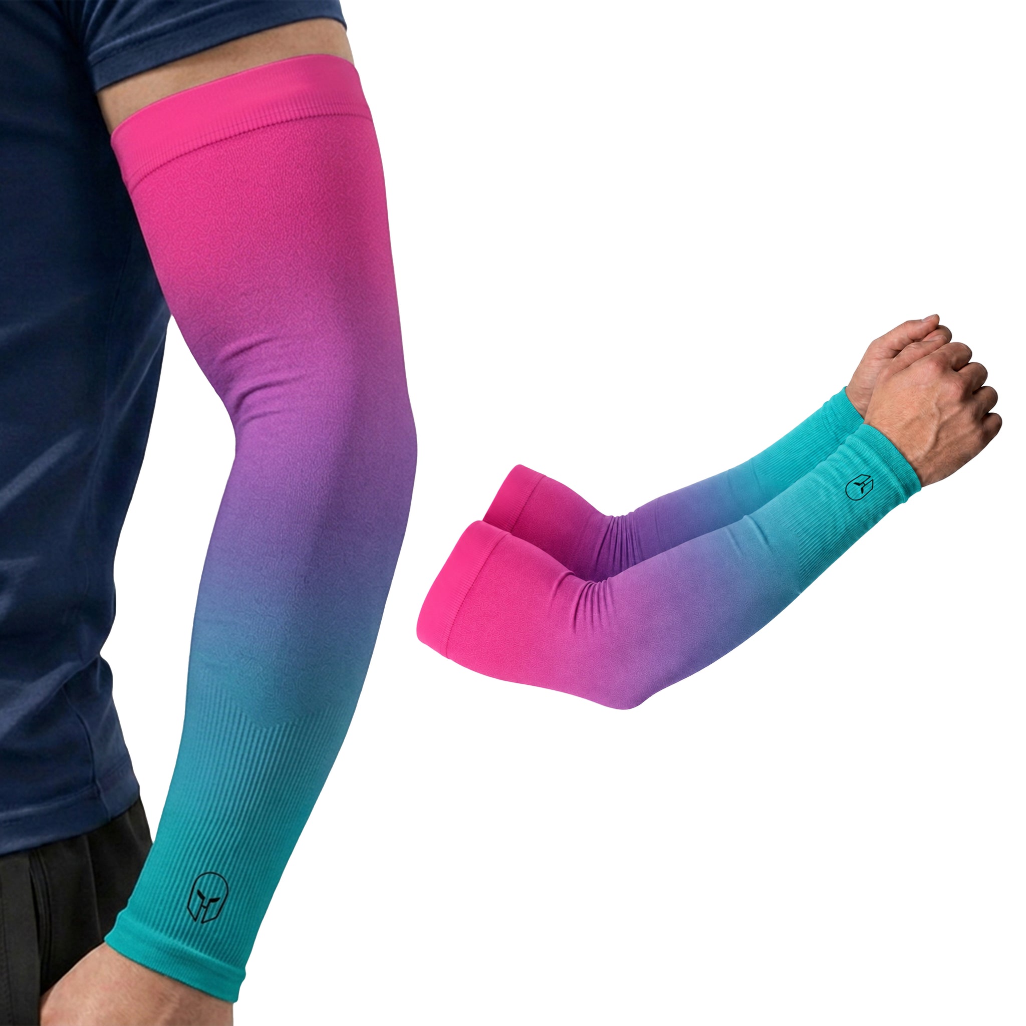 A person is wearing an ARMORAY Ombré Collection arm sleeve featuring a pink-to-blue gradient; next to the arm is a separate, matching pair of UPF 50+ sleeves from the same collection, providing UV protection.