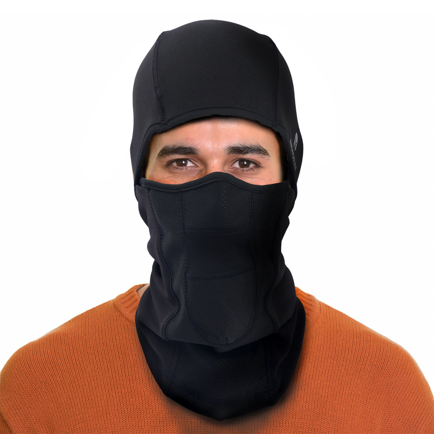 A person wears an ARMORAY Basics BALACLAVA in black and an orange sweater, facing forward against a plain white background.