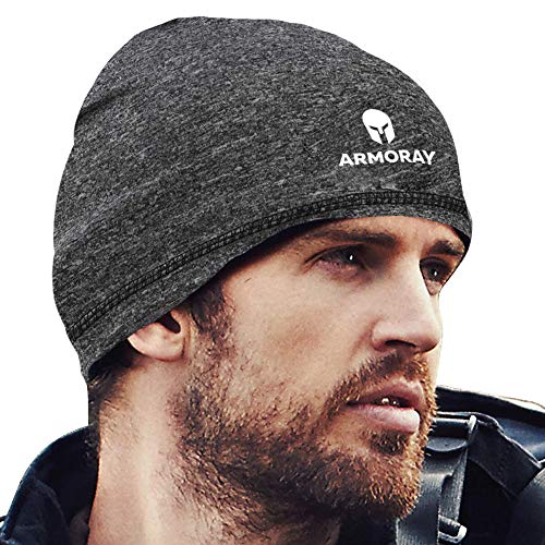 A bearded man wears an ARMORAY Basics Armoray Skull Cap, a dark gray, sweat-wicking running hat beanie featuring the Armory logo and text, as he looks off to the side.